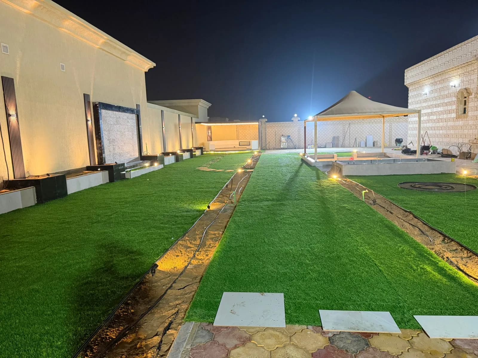 Waterfall, Planting Beds, Pergola, Ground Seating & Artificial Grass in Umm Al Quwain
